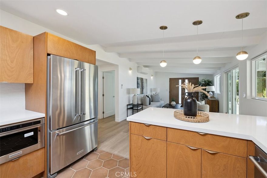 Stunningly remodeled and ideally situated in Santa Barbara's sought-after Eastside, 21 La Cadena offers turnkey coastal living just minutes from the beach. Nestled on a quiet street with exceptional walkability, this 3-bedroom, 3-bathroom home blends thoughtful design with modern comfort.



Inside, the 1,100 sq ft layout has been reimagined with open, light-filled living spaces and elevated finishes throughout. The kitchen features custom birch wood cabinetry, Arctic White Quartz countertops, and a Bedrosians Clara matte white backsplash paired with terra cotta tile and coordinating flooring. Brushed nickel fixtures and premium KitchenAid appliances complete the space with style and function. Bathrooms are finished with Delta brushed gold hardware, Zellige ceramic tile, and Hudson Valley sconces, creating a refined, spa-like atmosphere. Two ensuite bedrooms offer privacy and luxury, including one with a spacious walk-in closet and soaking tub. Additional highlights include designer sconce lighting, Troy collection mirrors from Lightopia, and two new climate-control mini splits for year-round efficiency.



The outdoor spaces are designed for both relaxation and entertaining. A pergola, newly updated with T-111 wood, shades the custom BBQ and sink station with matching stand. A new garage, custom front gate, updated mailbox and street numbers, and stylish exterior lighting add curb appeal and function. Set on a 5,227 sq ft lot, the property offers a private retreat with modern amenities just steps from cafés, restaurants, and boutique shops.