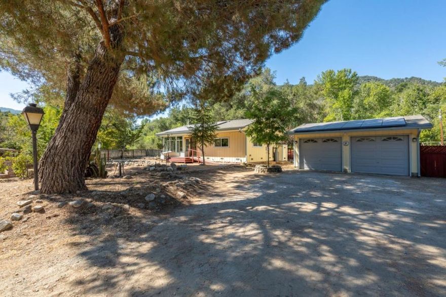 Tucked away along the gentle bends of the Carmel River, this charming 2-bedroom, 1-bath home offers a rare opportunity to live immersed in naturejust 25 minutes from the village, yet a world all its own. Set on a private 1-acre parcel, the property unfolds like a personal sanctuary, where the peaceful rhythm of the river and a secluded sandy beach create a truly one-of-a-kind retreat.  Thoughtfully updated and move-in ready, the home features a fully remodeled kitchen and bathroom, new plumbing, a new roof, updated water heater, and air conditioning. A leased solar system and private well provide efficiency and self-sufficiency for a more independent lifestyle all while enjoying the comfort of modern amenities.  Beyond the main house, a detached two-car garage offers convenience and flexibility, while two small outbuildings serve perfectly as storage, a tool shed, or even a woodworking studio. With ample space for a kitchen garden, potential ADU, or simply room to breathe, the property is a canvas for your vision.  Turnkey, updated, and rich in natural beauty 17900 Cachagua is more than a home. It's a soulful escape in the heart of Carmel Valley.
