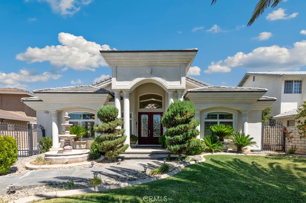 WELCOME TO A BEAUTIFUL & UNIQUE CUSTOME HOME! Located in the desirable area of Spring Valley Lake. A two (2) story home with three (3) bedrooms and three ½ (3 1/2) bathrooms. Enter through the double doors into this amazing home, greeted at the foyer with marble floors and skylight. On one side of the entry is a formal living room and on the other side is formal dining room. The family room has a beautiful fireplace, custom built entertaining center with an open floor plan for a complete entertainment area. The kitchen features a big breakfast bar with a sink, island, custom made cabinetry, walk in pantry, new smart appliances, new stove top, granite counter tops, and breakfast nook. Two bedrooms with private bathrooms each are conveniently located downstairs. Next to these rooms is a ½ bathroom for your guests. Laundry room with utility sink and cabinets. A custom staircase that takes you upstairs to a loft and the Primary suite, entering through double doors and an entrance with marble floors and private bathroom with double sink, a jacuzzi tub surrounded by marble floors, custom-built cabinets and walk in closet. The primary bedroom has carpet, a double-sided fireplace, a half-moon platform for a personal sitting area, walk to the balcony and enjoy a view of the Valley city lights. Throughout the home you have custom made crown molding, plantation shutters, custom cabinetry, vaulted ceiling, and beautiful chandeliers. Open the wrought-iron gate and your private driveway that takes you to the backyard and to the attached two-car garagewith plenty more space for parking. Want to BBQ? The backyard has plenty of space to do so and has mature fruit trees. Enjoy the amenities that the community offers: park, beach area, golfing, boating and more. This is truly a pride of ownership home! Lots more to describe, this is a must see to appreciate! Schedule your private tour today and come visit us before it is gone!