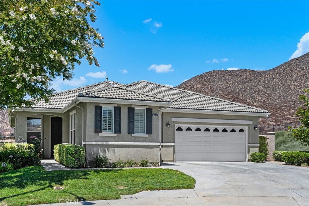 Gorgeous Tuscany Plan ( 2442 sq ft 3 Bedrooms) in the 55+ Gate Guarded Resort Style Community of the OASIS! Property is located on a one-of-a-kind elevated end of cul de sac lot. Cool Breezes and Fantastic VIEWS of the Mountains, City Lights and Sunset! Front Living Room area has Beveled Leaded Glass windows and a private Dining Room area. Plantation Shutters & Crown Molding throughout and Builder upgrade to European Arched doorways. Custom Fans and Coffered Ceilings in Family Room and Primary. Chefs Gormet Kitchen with two walks in Pantry's, Double Ovens, Bosch Dishwasher and Elegant Cream Corian Counters. Rich Darker Cabinetry with Custom Hardware, Large Breakfast Island with seating for four with additional eating area. Huge Family Room (Gas starter fireplace) with Views to the Amazing Yard and Beyond. Primary Suite has sliding door to rear patio area, his and hers closets, walk in shower (with seating) and an oval soaking tub. Custom plumbing and light fixtures. The two additional Quest Bedrooms are on opposite side of the home from Primary. Super-Size Laundry has 14 cabinets and large soaking sink...leading to the two-car garage with side storage cabinets and epoxy floors! In addition, there is a SEPARATE GOLF CART GARAGE! With its own roll up door and remote! BEYOND SPECTACULAR Rear Yard with Stamped Concrete, Aluma wood Patio cover with plant drip system, Professionally Landscaped, pull down Sunshades, Built in BBQ with Service Bar and multiple fruit trees (Lemon, Lime & Orange). This larger PREMIUM Lot has no side or rear neighbors with block wall and Vinyl Fencing. Your private OASIS awaits! VIEW the Video slideshow for optimal pictures. HOA covers front yard water and Lanscape care as well as the trash service. Minutes from all new shopping, medical, restaurants and easy freeway access. Approx an hour and half from Popular So Cal Beach, Desert and Mountain Locations. Short drive to Famous Temecula Valley Wine Country!