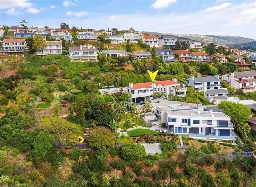 Massive Lot, Private Cul-de-sac, Ocean Views Grandeur | Your Laguna Beach Oasis



Discover unparalleled luxury at 766 Pelican Drive, an exquisite estate in Portafinã, the heart of Laguna Beach. An architectural gem designed by award winning architects Marca Weston Whitfield, this custom soft contemporary home features creative use of angles and curves making the exterior design and every room a work of art boasting breathtaking panoramic views that will leave you captivated.

Immerse yourself in refined living spaces adorned with Brand Van Edmond lighting, pristine finishes, creating an atmosphere of sophistication and tranquility.  The gourmet kitchen is a chef's dream, featuring top-of-the-line appliances and a spacious bar perfect for culinary exploration. Unwind in the luxurious spa-like bathrooms, including a primary suite oasis complete with a rejuvenating steam shower.  Experience the ultimate in indoor-outdoor living as you seamlessly transition from the elegant interiors to the sun-kissed terraces.  Step outside to your massive private outdoor sanctuary, where a Jacuzzi and fire pit beckon relaxation. Lush landscaping and mature fruit trees create a serene ambiance among a massive lot.  Recent upgrades include energy-efficient Anderson windows and custom powered blinds enhancing both comfort and style.  Located at the end of a cul-de-sac with ample parking, a 3 car garage and gated extended driveway.  This extraordinary property offers an unparalleled opportunity to experience the epitome of Laguna Beach living with world-class dining, shopping, and entertainment just moments away.
