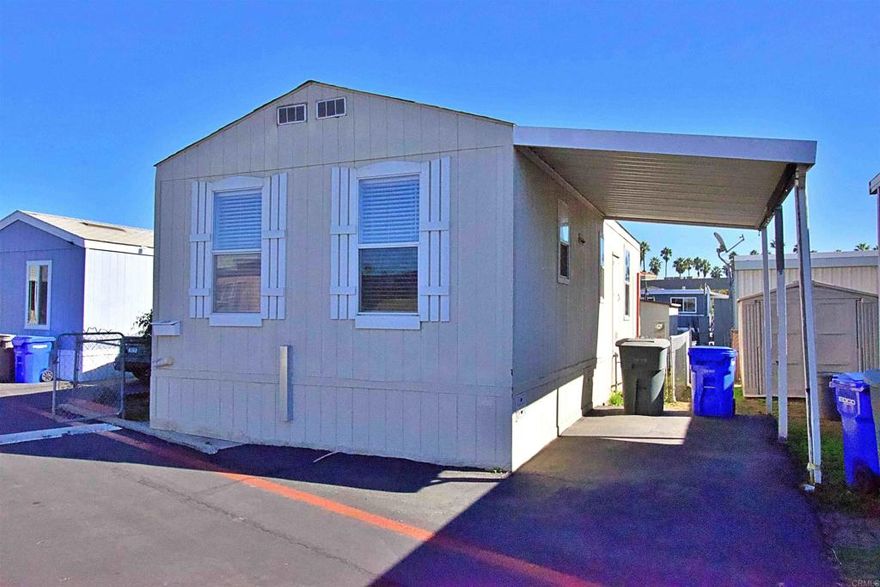 1Bed + Den (usable as a second bedroom) 2003 home with laminated floors, stove, refrigerator, washer, dryer in an affordable ALL AGES park (spc rent 1065/month) It has a carport with space for 1/2 cars and a yard with a shed. A/C split.