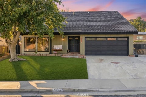 Photo of 28975 Lotusgarden Dr, Canyon Country, CA 91387 (MLS # SR26206704)