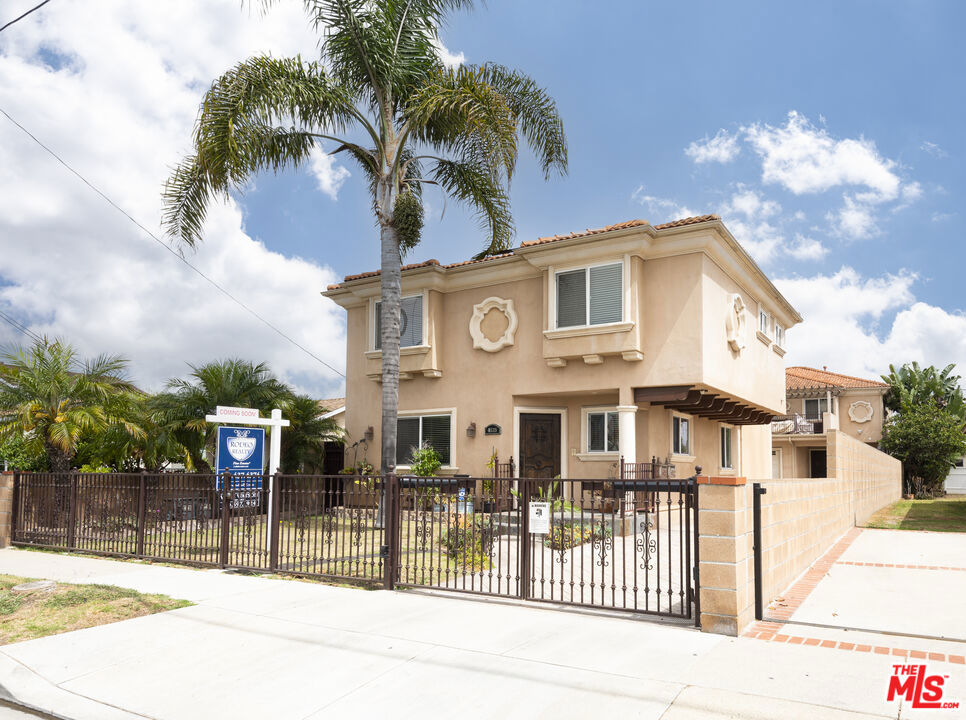 Welcome to this beautifully updated classic Mediterranean 3 bedroom, 2.5 bath home offering nearly 1700 square feet of living space. The living room boasts gleaming wood flooring, crown molding, recessed lighting and a cozy fireplace, creating a warm & inviting ambiance. The living room is bathed in natural light seamlessly flowing into the updated kitchen featuring stainless steel appliances, granite countertops, handsome cabinetry, and ample storage. The primary suite is a true retreat complete with wall to wall closets, a luxurious ensuite bathroom with a soaking jet tub, separate shower, dual vanities, and a private relaxing balcony perfect for siestas. Two large bedrooms offer space and versatility of usage. Additional features include a large 2 car garage, solar system, central vacuum system & more! Only 10 minutes from the beach this home is centrally located minutes from premier dining, shopping and entertainment. Don't miss out on this stunning, move in ready home!