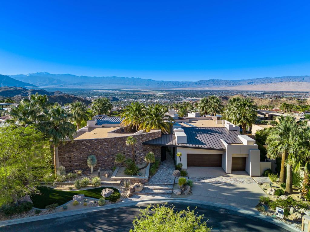 Experience elevated luxury in this stunning 6,742-square-foot contemporary masterpiece designed by acclaimed architect Dave Prest. Perfectly positioned in the prestigious Mirada Estates, this four-bedroom, four-and-a-half-bath residence offers expansive, unobstructed views of the valley floor that stretch for miles.Every detail has been thoughtfully curated--from the sleek lines of the architecture to the upscale finishes throughout. The open-concept living space is anchored by a state-of-the-art kitchen featuring upgraded appliances, custom cabinetry, and seamless indoor-outdoor flow. The huge outdoor living spaces have ceiling heaters for cool nights and misters for hot days. Retreat to the private gym for a focused workout or unwind in your own home theater for the ultimate movie night experience.With generously sized bedrooms, spa-inspired baths, and designer touches in every corner, 55 Granite Ridge is a rare blend of form and function--offering a lifestyle of comfort, sophistication, and panoramic beauty.