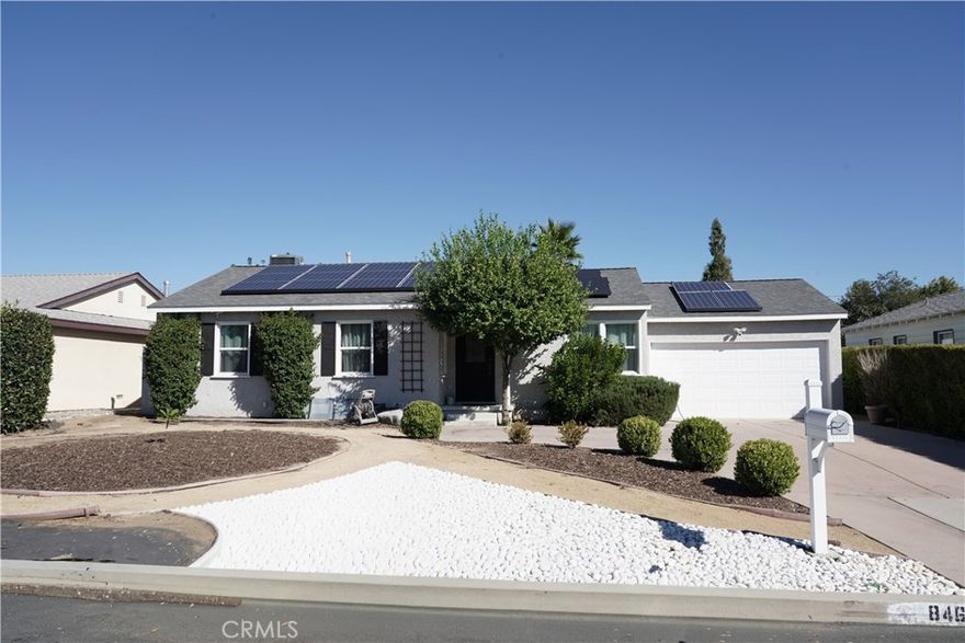 Discover modern elegance and effortless comfort in this beautifully updated single-story home offering nearly 2,000 sq ft of open, sun-filled space on an expansive 9,400 sq ft lot. Soaring vaulted ceilings, rich hardwood floors, and a stylish fireplace create a welcoming ambiance that flows seamlessly through the living and dining areas. The upgraded kitchen features quartz countertops, stainless-steel appliances, and generous cabinetry. The primary suite provides a tranquil retreat with a cedar-lined walk-in closet and a spa-inspired bath. Step outside to a private backyard oasis with a sparkling saltwater pool, soothing spa, and spacious patio perfect for entertaining or quiet relaxation. Energy-efficient amenities include paid-off solar panels and an EV charging station. Situated on a peaceful, tree-lined street near parks, top schools, shopping, and dining—this move-in-ready home defines comfort, style, and sustainable luxury.