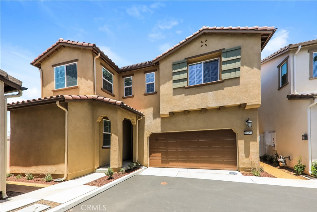 This home is professionally managed by Tricon Residential, dedicated to creating exceptional rental experiences. Featuring four bedrooms, three bathrooms, and approximately 2,086 square feet, this well-maintained home offers a high standard of rental living, supported by a team that puts residents first. Tricon Menifee is a secure gated rental community nestled between San Diego and Orange County. Enjoy virtually maintenance-free living with the conveniences of smart home technology including automatic thermostat control and keyless front door entry. Every home offers open concept designs including stainless steel appliances, quartz countertops, two-car attached garages, and in-home washer and dryer. Enjoy well-maintained community amenities including a lap pool and spa, sundeck with ample seating, dog park, tot lot/playground, fire pit, BBQ area, fitness center and clubhouse.