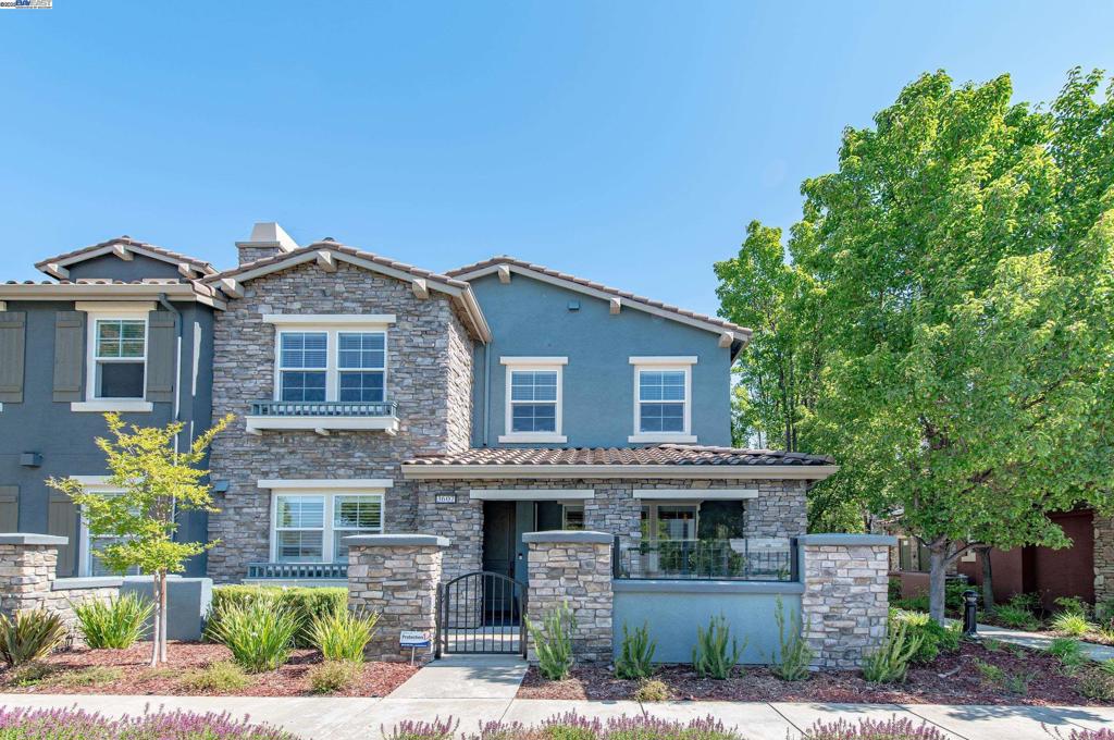 Beautifully updated end-unit townhouse in Dublin’s Sorrento community offering style, space, and flexibility. A gated front patio and covered porch welcome you in. Renovated in 2019 with luxury vinyl flooring, fresh paint, new carpet, crown molding, plantation shutters, and custom stair rails. The garage features epoxy flooring and a LiftMaster door with battery backup (2020). A whole-house Pureflo water conditioner was added in 2023. The open-concept main level connects the Family Room, Dining Room, and Kitchen with recessed lighting, crown molding, and French doors to a private patio—perfect for barbecues or quiet evenings. The Family Room includes a gas fireplace and large windows. The Kitchen offers granite countertops, breakfast bar, tile backsplash, and stainless appliances. A powder room adds convenience. Upstairs, the Primary Suite has a walk-in closet and en-suite bath. A second en-suite bedroom has a full bath, and two more bedrooms share a third bath. Laundry room upstairs. Third floor loft is perfect for office, gym, or guest space. Across from Emerald High. HOA includes pool, spa, gym, clubhouse, park, and playground. Broker's Tour Fri Jun 27, 10:30-1p | Open House Sat & Sun Jun 28 & 29, 1-4p.