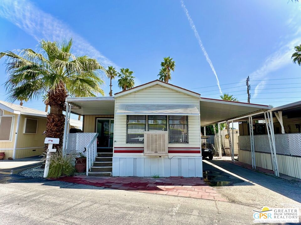 Adorable and updated park model with California room and covered porch as well a carport. Freshly painted and bright and clean. A wonderful opportunity, and a terrific 1BR/BA with a california room adding additonal 200 sq ft of space ...in one of the best parks of south Cathedral City! Royal Palms is known for it's fun in the sun, an active 55+ community with a clubhouse, fitness center, pool & spa, and a host of amenities like the pickleball courts, putting greens, or shuffleboard. This home has been nicely upgraded with laminate wood flooring throughout, the new cabinets & quartz countertops at the kitchen. Also, this home comes with the staples of newer electric & plumbing, dual pane windows in some locations, plus a swamp cooler for zoned cooling. This home is rather efficient and always comfortable! All new appliances. The private rear yard, offers privacy and serenity . Carport & storage units outside included. Royal Palms is a pet friendly place too, with dog parks and walking areas, plus RV/other optional services too. Park's space rent of ~$825 covers most things, no HOA. Make your appointment to view today.