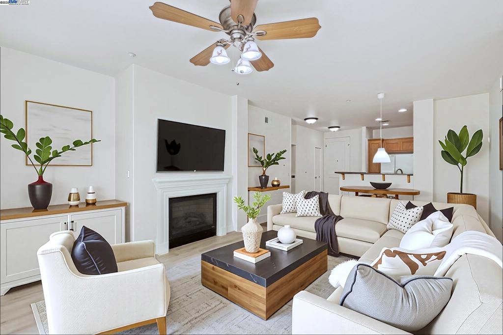 Desirable single level corner end-unit on the first floor offers a lifestyle of luxury and convenience. Large private patio perfect for entertaining and relaxation seamlessly transitions to the serene courtyard, creating a lovely indoor-outdoor living experience. 9-feet ceiling, natural light and open layout great room creates an airy and modern atmosphere. New paint and beautiful LVP flooring throughout the entire unit. Kitchen offers granite counters, maple cabinets, eat-in breakfast bar. Primary bedroom includes a walk-in closet and ensuite bathroom with a double vanity and walk-in shower. The third bedroom provides a versatile space for a home office, gym, creative studio, guest room or playroom. Central AC and heating system and ceiling fans. Washer/dryer in hallway closet. Resort style amenities include a clubhouse with gourmet kitchen, state-of-the-art gym and heated pool and spa. 24-hour secured gate entry. Assigned 2 side-by-side parking spaces in the secured underground parking lot with guest parking spaces and elevator access. Prime location near top rated schools, shopping, restaurants, golf, Kaiser, BART and 580/680. Walk to the new Emerald High School, Bray Commons Park with a fenced dog park, playground, basketball court. Please note 4 photos are virtually staged.