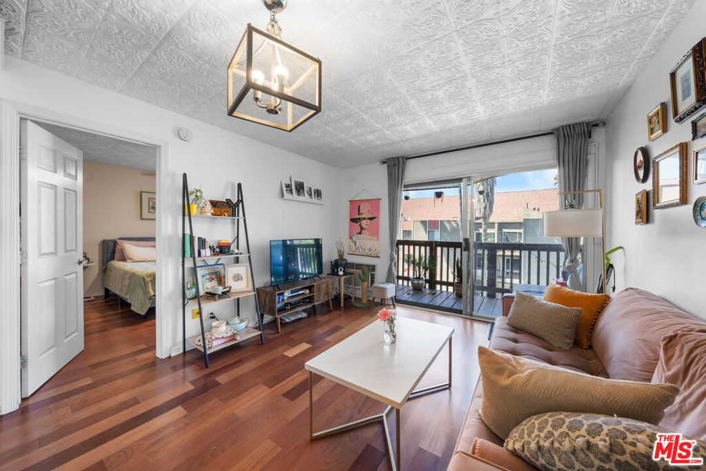 Welcome to this bright and airy top-floor 2-bedroom, 2-bathroom unit in Prime location of the heart of Koreatown. Thoughtfully designed with separated bedrooms for added privacy, this home features an open layout with wood floors throughout and a spacious walk-out balcony, perfect for relaxing or entertaining. The modern kitchen features stainless steel appliances, ample cabinet space, and a functional layout ideal for cooking and hosting. Designed for both comfort and privacy, the bedrooms are thoughtfully separated within the layout. Enjoy a modern kitchen with stainless steel appliances and ample cabinet space. Located in a vibrant neighborhood just steps from Koreatown's best cafes, restaurants, and shops with convenient access to major freeways. Just a short drive to Hollywood, Mid-City, and Downtown LA, making this the perfect central hub for city living.