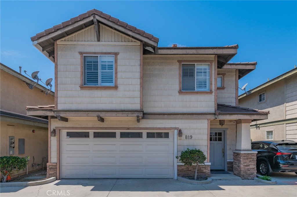 Built in 2003, this well-maintained 4-bedroom, 3-bathroom home offers 1,683 sq.ft. of living space featuring a spacious primary suite with walk-in closet and dual-sink bathroom, open kitchen with upgraded countertops and stainless steel appliances, bright living room with gas/wood-burning fireplace, two-car attached garage with in-home laundry, fresh interior paint, private landscaped patio, fire sprinkler system, and pre-wired security. Located in a quiet 4-home community near Good Fortune Market, dining, public transit, and freeway access, and zoned for Wild Rose Elementary, Santa Fe Magnet, and Monrovia High School.