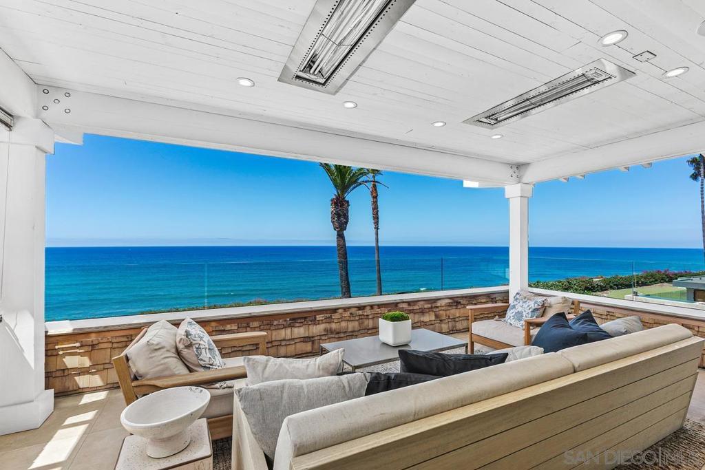 The Hamptons meets ocean front living in Olde Del Mar with this custom three-level property with elevator, pool/jacuzzi, movie theater, 3-car garage & massive ocean views down the coastline! Newly built in 2019, this 6,283 square foot 4-bedroom, 6-bathroom home is a true entertainer’s dream. Located at the end of a long drive & privately gated, this prestigious “smart home” property features an ideal open floor plan perfect for indoor / outdoor living. The backyard offers covered dining space, outdoor fireplace, ceiling heaters, evo grill + full outdoor kitchen. The primary suite retreat is on the top floor & offers a private deck & gorgeous bathroom with a free-standing tub, glass steam shower + His & Hers double vanity. The primary suite retreat also offers a spacious closet complete with island, built-in Miele coffee machine, washer & dryer & wall safe. A second bedroom is also on this top story, with two more bedrooms on the basement level. The basement level, perfect for out-of-the-sun entertaining or relaxing, offers a full gym, dry sauna & restorative steam room. Also on this level is the home theatre, with seating for 12 & a temperature-controlled glass wine cellar + a full bar. Enjoy shopping & fine dining all within walking distance from this ocean front masterpiece.