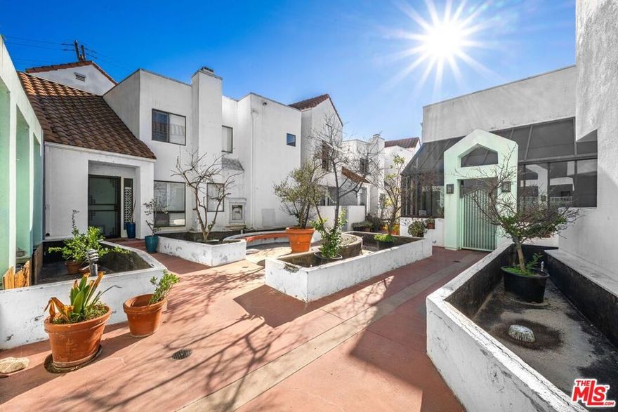 Beautifully maintained townhome in a prime Glendale location, just moments from Kenneth Village. This gated community offers a spa and secure underground parking with two side by side assigned spaces. The home features an open layout with high ceilings, recessed lighting, and two private patios: one of which is spacious enough for outdoor entertaining and a full dining setup. A lovely family has made this house a home for many years, and you feel it the moment you walk in. Both bedrooms are upstairs with two full baths, plus a guest bath on the main level. The primary suite offers vaulted ceilings and an en-suite bath. Laundry is conveniently located upstairs. Move in ready and a fantastic opportunity for buyers.