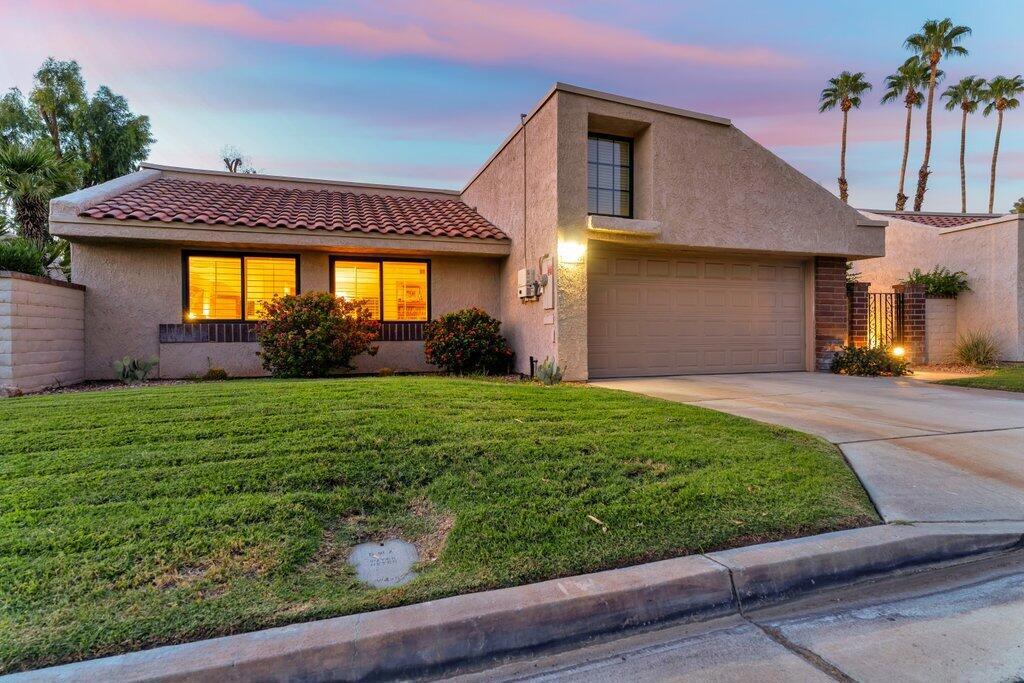 Welcome to your Desert Oasis! This isn't just a home; it's a completely maintenance-free lifestyle waiting for you. Step inside this recently renovated, spectacular 1,887 sq ft sanctuary and prepare to be amazed. Every inch has been meticulously upgraded with over $137,000 worth of improvements, so you can stop searching and start living! Imagine waking up to breathtaking views of the golf course and the majestic San Jacinto Mountains from your two oversized large patios. The community pool and spa are just steps from your door--perfect for a quick dip after a day of golf or shopping. Inside, vaulted ceilings create an expansive feel throughout along with three large bedrooms and two beautifully updated baths. Entertain with ease in the huge living room with vaulted ceilings, a cozy fireplace and wet bar equipped with TWO wine refrigerators. The formal dining area flows into a stunning kitchen, a chef's dream with custom cabinets and sleek stainless-steel appliances and ample storage. The primary suite is a true retreat, tucked away for ultimate privacy and featuring a massive, mirrored closet and a luxurious ensuite bathroom. A separate laundry room offers endless storage, keeping your home organized and clutter-free. Entertain alfresco on the expansive, partially covered back patio, where stunning golf course and mountain views provide the perfect backdrop. Need a moment to yourself? The second, private patio is a peaceful haven, professionally desert landscaped with fountains perfect for your morning coffee or quiet relaxation. This home is as turn-key as it gets. This home has been thoughtfully updated for decades of worry-free living, with major recent investments that include a 5 ton 16 SEER HVAC system, PEX plumbing, dual paned windows, updated flooring, walk-in showers, plantation shutters, newly painted interior, patios that were professionally desert landscaped including new hardscape, dramatic landscape lighting, there is also an oversized solar system that provides worry free electric bills and so much more. The HOA even takes care of the building, landscaping, trash, pools, spas and includes cable and internet! Located within the prestigious, gated Palm Springs side of the Cathedral Canyon Country Club, you're minutes from Palm Springs' best golf, shopping, dining, casinos, hiking, and the airport. This is a must-see! Don't miss your chance to own a piece of desert paradise!