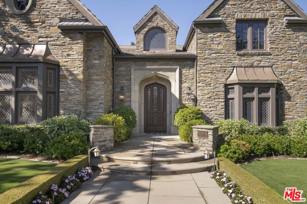 Gorgeous custom-built estate tucked away on a private street in prestigious North Ranch. The meticulously manicured park-like grounds evoke a sense of tranquility, with a majestic oak canopy that creates a storybook setting. The classic timeless design underpinned by impeccable quality of construction and intricate handcrafted details ensures a standard of quality that stands the test of time. Grand proportions, realized by the pitched gable roof and a soaring foyer, instantly welcome and impress you, your family and guests into this timeless haven. The grand sunlit living room with marble fireplace exudes elegance. The updated contemporary color palette throughout enhances the classic charm, creating a seamless blend of modern sophistication and traditional allure. The large kitchen is a chef's dream, seamlessly opening to a covered patio with a fireplace and ample seating an ideal spot for dining beneath the stars. The outdoor covered area is the heartbeat of the property, overlooking the pool and the glorious grounds-this is where life's memories are served. The Downstairs suite is perfect for a mother-in-law or live-in staff. The detached Guest House serves as an ideal office as well, but can accommodate long-term guests. Two staircases serve the upstairs private living quarters. Large secondary bedrooms are near the primary suite, while a huge Media Room and Gym with a private full bathroom offer ample opportunity for screenings and sleepovers. Play golf at North Ranch in the morning and then Sherwood Country Club after lunch. The entire family can walk across your private street to a magnificent open park/play field. Every detail, from the architectural design to the landscape, reflects a commitment to luxury and perfection. This is not just a home; it's a statement of prestige and refinement in one of the most sought after neighborhoods. Showings by Private Appointment.