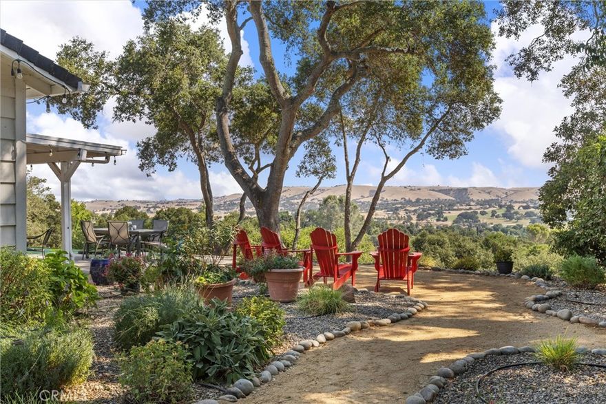 Welcome to 5355 El Verano Ave, a one of kind property with stunning views.  Completely remodeled, this single story 4-bedroom, 2 bath, 2,424 sqft home is perfectly situated on an oak studded hilltop one acre lot.  Upon entering the home you’ll see a peak of the views from the entry pulling you toward the living room & kitchen. But as you proceed toward the views, you’ll notice the exquisite remodel and attention to detail with crown molding, solid core interior doors, high end 8” plank vinyl flooring and recessed lighting throughout the entire home. From the entry on the left through beautiful double French doors is a spacious office/den or guest accommodations. The hallway begins on your right with the custom guest bath complete with a quartz countertop vanity and custom tile shower. Three spacious bedrooms are located down the hall with the primary suite offering a walk-in closet, additional double closet, exterior double French doors leading to the covered deck and located facing East to enjoy the amazing sunrises that occur throughout the year.  The primary bath includes an amazing soaking tub, spacious tiled shower, quartz counter tops and dual sinks. From the entry and hallway, the view begins to present itself leading you into the heart of the home where the custom kitchen opens to the living room and dining area with large picture windows showcasing the spectacular views of the Salinas River Valley.  The custom kitchen offers quartz countertops, a spacious island with bar seating, stainless-steel Kitchen Aid appliances that include a double oven, dishwasher, 4-burner stove with a griddle & grill all complimented by a retractable wall mounted pot filler nicely situated with the subway tile backsplash. The dining area is just off the kitchen with a built-in cabinet with quartz countertop and two generous wine refrigerators. Adjacent to the dining area is the movie room or fourth bedroom with digital 7.1 Dolby sound. Additional amenities include covered RV parking, owned solar, oversized 2-car garage with built-in cabinets and work bench, custom concrete basketball area with top-rated outdoor hoop, putting/chipping green, newer HVAC, all new electrical & plumbing, dog kennel, and detached shed that could be an office. This property offers a comfortable lifestyle with privacy, amazing views, all within walking distance (1 mile) to the new revitalized Atascadero downtown where you can enjoy nice restaurants, music, and the sunken garden farmer’s market.