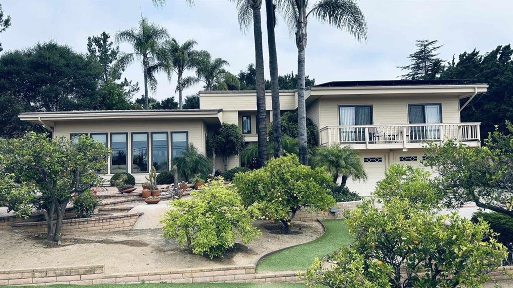 First time on the market for this beautiful, spacious 4 bdrm/2.5 ba. home set in the peaceful, serene shadow of Bernardo Mountain, close to the Lake Hodges hiking trails, local parks and major So Cal tourist attractions. Enjoy the opportunity to own this private, .57 ac hidden-gem paradise retreat in the highly desired Southwest Escondido location. Enjoy breathtaking panoramic view over the valley and distant hills from many vantage points on the grounds of this smartly-designed, friendly-living custom home. Additional amenity offerings that enhance the enjoyment of the coveted So Cal outdoor lifestyle are the solar-heated pool, water-saving, xeriscaped surrounding grounds, multiple outdoor entertaining areas, an OWNED SOLAR system and a living-friendly home floor plan. The welcoming front door introduces a bright and airy open- concept kitchen and shared family room, complete with a large granite-tiled island, walk-in pantry, white appliances and a plethora of cabinetry/storage. those special gatherings with loved ones and friends are further enhanced with adjoining formal dining room and living room, featuring perfectly placed picture windows offering panoramic distant views! The main floor primary bedroom, offers privacy and ease of access, including a huge ensuite bathroom space, a low rimmed. roll in shower as well as a large walk in or roll in closet. The additional three bedrooms and full bath, located upstairs, are nicely balanced above the 2 car garage with workshop space. Located just minutes from freeway access, shopping, dining, and top-rated schools, this home offers the perfect blend of seclusion and convenience. Whether you are relaxing at poolside, or enjoying the peaceful, scenic, beautifully manicured grounds, you will love the tranquil and private setting this property provides. Save this one to be alerted when it goes active!
