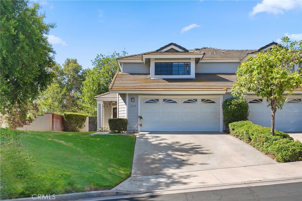 Gated community of Crawford Country Estates in Riverside. Step through the double-door entry into a bright, open living space. The living room showcases vaulted ceilings, large windows, and a distinct step-down layout that creates both inviting relaxation and elegant entertaining areas with a fireplace and is the heart of the home—warm, spacious, and filled with natural light. Off of the living you will find a dining off of a large kitchen featuring a counter-height breakfast bar, ideal for casual dining and entertaining. Upstairs, you'll find 2 generously sized bedrooms, each offering their own private bathroom for privacy and comfort for family or guests. Step into the backyard where space is no issue and you will find a very unique built in spa with gazebo.The home also includes a large driveway, an attached 2-car garage, and is located in a serene setting with direct access to community walking trails. One trail leads to the community pool, while another guides you to a greenbelt area perfect for picnics, pets, and outdoor play. The HOA fee includes front landscaping, homeowner’s hazard insurance, and exterior building maintenance, ensuring peace of mind and curb appeal. Don't miss this opportunity to own a home in one of Riverside’s most sought-after gated communities. Schedule your private showing today!
