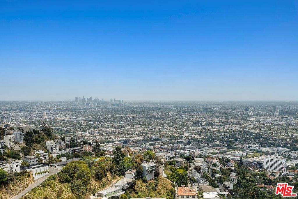 A rare opportunity to create a custom estate above the legendary Sunset Strip, showcasing sweeping jetliner views. Privately located behind gates at the end of a long driveway and secluded cul-de-sac, this quarter-acre lot in the Hollywood Hills offers ultimate privacy and dramatic sightlines from downtown Los Angeles to the Pacific Ocean and Catalina Island. Nestled in a world-class setting just minutes from Beverly Hills and the Sunset Strip, this is the perfect canvas to build your dream home above it all.