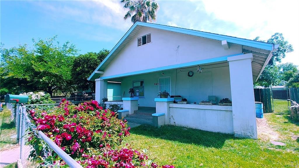 FIXER! YOUR NEXT PROJECT! Vintage 1922! 1140 sq ft. 3 bedroom, 1 bath, on a large .18 ac lot! Front yard greets you, behind cyclone fence & gate. Up the front steps, find a large covered front porch! Enter into cozy living room featuring a brick fireplace w/mantle & built-in shelves. A country kitchen, large dining area, has breakfast bar, a pantry, & leads out to enclosed porch, sizable laundry area, and an additional storage room. Heater unit in kitchen, forced air, evap. cooler, provide heat & cool... Ceiling fans in almost every room! Outside in front, find a storage shed, off street parking behind the gates. Out back, find a large shaded fenced back yard, mature plants, a small wood shed, & a sunny side of yard... gardening anyone? Alley access at back of lot, there is a gate in fence. Buyer to investigate all aspects of property to contractual satisfaction. Property is presently rented, long term tenants, 24 hour notice please....Call your favorite REALTOR/Agent to schedule a viewing!