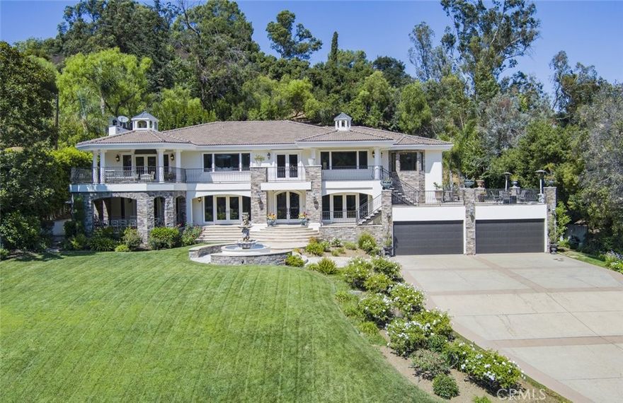 Positioned within the esteemed Fryman Estates, this private contemporary Mediterranean villa is situated on nearly an acre of meticulously manicured grounds in prime Studio City. The secured property showcases breathtaking panoramic views of the surrounding mountains and canyons. With approximately 8,000 square feet of luxurious living space, the residence features seven en-suite bedrooms and nine bathrooms. The gourmet kitchen, complete with a spacious island and breakfast area, highlights premium Viking and Sub-Zero appliances. The primary suite includes a expansive private patio, generous walk-in closets, and a spa-inspired bathroom. The outdoor entertainment area is replete with a pool, spa, BBQ area, and meticulously landscaped grounds.  An ideal relaxation yet great entertainment.   Additional notable features include a formal dining room, screening room, and wine cellar. As a trophy property within the exclusive Fryman Estates, this exceptional home offers unparalleled seclusion and quality, providing outstanding value.This is more than just a home—it’s a lifestyle. Don’t miss your chance to own a rare and remarkable mansion in one of Los Angeles’ most desirable neighborhoods.  A must see gem !!!