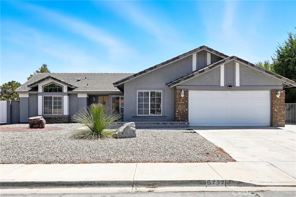 Welcome Home! This beautifully updated single-story residence offers the perfect blend of charm, functionality, and room to grow. Nestled on an expansive 18,000 sq ft lot, the property features low-maintenance, drought-tolerant landscaping and generous outdoor space for entertaining, relaxing, or future expansion.
Inside, you'll find a warm, open-concept layout and a welcoming family room anchored by a classic red brick fireplace. The kitchen shines with granite countertops, subway tile backsplash, and direct access to a versatile garage space—complete with laundry hookups, a utility sink, a dedicated workout area, and a water softener system for added comfort and efficiency.
French doors lead to a backyard retreat designed for memorable gatherings—featuring a pergola-covered patio, built-in BBQ, brick fire pit, and RV access.