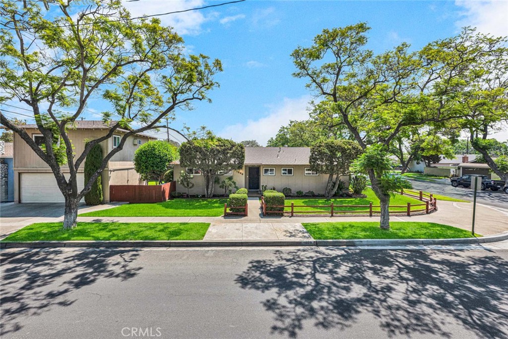 TWO ON A LOT combo!!Welcome to one of the most sought-after streets & neighborhoods in Santa Ana—where a canopy of breathtaking Jacaranda trees sets the tone for warmth & charm as you arrive at this exceptional property.Nestled in the family-friendly neighborhood of Mabury Park,this dual-home setup offers the perfect blend of flexibility,comfort & value—ideal for multigenerational living,rental income,or a private home office.Main Residence – 3 Bed | 2 Bath | 1,421 Sq Ft + Detached ADU | 400 Sq Ft = Total of 4 Bed | 3 Bath | 1821 Sq Ft.Step into a bright & inviting home w/ a spacious open floor plan centered around a beautiful dual-sided brick fireplace w/ a cozy sitting hearth.Enjoy natural light streaming thru dual-pane vinyl windows,complemented by plantation shutters & newer blinds thru-out.The kitchen is nicely updated w/ elegant wood cabinetry,Quartz countertops,classic butcher block counter,S/S appliances,dual ovens,4 burner cooktop.Gorgeous brand new vinyl plank flooring enhances all the main living spaces,while the bedrooms offer warm,quiet retreats.Detached Mother-In-Law ADU –1 Bed | 1 Bath | 400 Permitted Sq Ft. Perched above the detached garage,the fully permitted ADU features a large living room,¾ bath & potential for a kitchenette,offering excellent versatility.Whether hosting long-term guests,generating income,or using it as a home office or creative studio,this separate living space delivers unmatched flexibility. Nestled on a private corner lot w/ extra room to breathe,this thoughtfully maintained home offers a lifestyle of comfort,charm & easy living.From the moment you arrive,the manicured front & back yards make a lasting impression—lush green lawns,vibrant flowerbeds,and fully automated sprinklers create a colorful,low-maintenance sanctuary.Step into the spacious backyard & discover your own private retreat:an expansive patio perfect for summer BBQs,weekend lounging, or gathering w/ friends & family.And thanks to the corner lot location,you'll appreciate the added privacy & flexible parking options—a rare and valuable perk.A freshly painted exterior,a newer HVAC system for year-round comfort & updated lighting fixtures provide light & bright living.This is a rare property that buyers are hoping to find—2 legal homes on one lot in a prime location w/ thoughtful upgrades.Whether you need space for extended family,want to earn passive rental income,or desire a private retreat in a beautiful neighborhood, this home checks all the boxes.