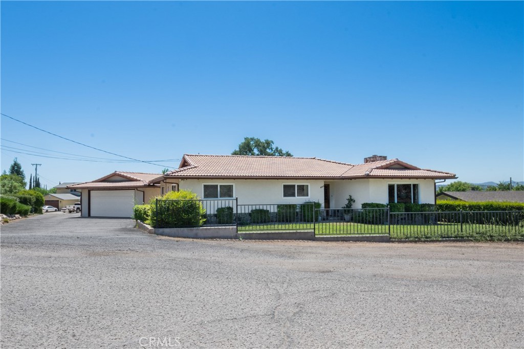 Welcome to 726 N Trigo Lane - a lovingly maintained single-level home just minutes from downtown Paso Robles and all the amenities this vibrant wine country town has to offer. Nestled on a spacious 0.41 +/- acre lot, this 3 BD, 2 BA home offers 1,761 +/- square feet of comfortable living space with views of the rolling, oak-graced hills from the kitchen window. Owned by the same family since the 1970s, the home carries a sense of warmth and pride of ownership. Inside, the kitchen has been tastefully updated within the last five years and features granite countertops, oak cabinetry and an eat-in area. A separate formal dining room provides additional space for entertaining. Both the kitchen and dining room open through individual sliding glass doors to the peaceful backyard, where you’ll find a lawn area and plenty of room for gardening and gathering. Beyond the back lawn and behind a hedge is a level area that would be an ideal place for boat or RV storage or a potential site for an ADU. The front yard offers additional lawn space and curb appeal. A detached two-car garage provides ample parking and storage. With its prime location close to shopping, dining, wineries, schools and downtown Paso Robles, this home is full of potential and ready for its next chapter!