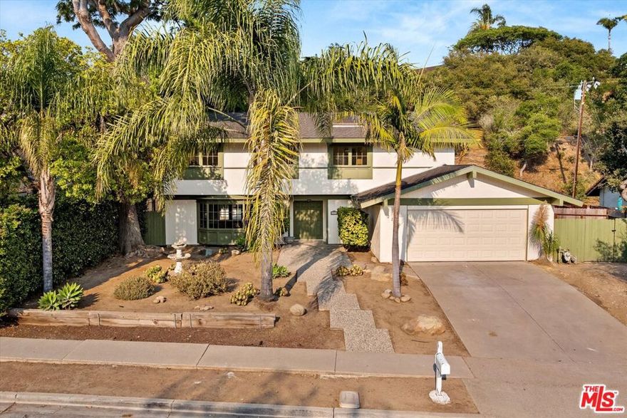 Located in the sought after Bel Air Knolls, this 5 bedroom, 2.5 bathroom home offers the ideal canvas to create your dream retreat. With solid bones and spacious proportions, it features a dramatic central skylight, a beautiful front bay window, graceful arched entryways, a classic fireplace, and vaulted ceilings in the upstairs bedrooms. Natural light pours through the main living areas, enhancing the home's warmth, charm, and architectural character. A private patio and expansive backyard provide ample space to relax, entertain or reimagine. The generously sized lot offers limitless opportunity for customization, expansion, or elevated outdoor living. Enjoy a peaceful setting with convenient access to Hendry's Beach, Elings Park, Douglas Preserve, the Mesa, and nearby hiking trail.