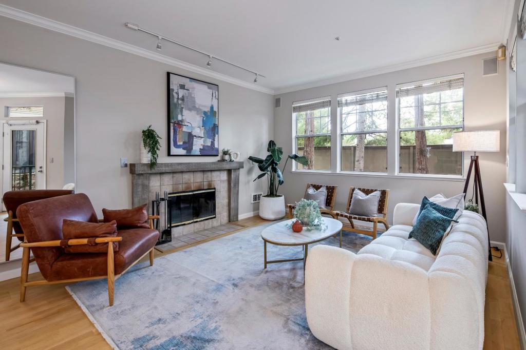 Rarely Available Menlo Park Gem! Discover this move-in ready, single-level condo built by renowned PPG in 1995. Designed with quality craftsmanship and a thoughtful floor plan, this home features a central kitchen opening to the living and dining areas, with bedrooms positioned on opposite sides for privacy. Enjoy hardwood floors, double-pane windows, a cozy fireplace, and the convenience of a full-size washer and dryer. Step outside to your own fenced, private patio perfect for relaxing or alfresco dining. Additional highlights include: Two dedicated parking spaces with secured gate access, Extra storage, Workout room, Elevator & stair access , Central community courtyard. The location is truly unbeatable: just steps from Stanford University & Sand Hill Road, minutes to Downtown Menlo Park & Palo Alto, with easy access to Highway 280. Served by award-winning Menlo Park schools, this is a rare opportunity to own a beautifully maintained property in one of the Bay Areas most desirable neighborhoods.