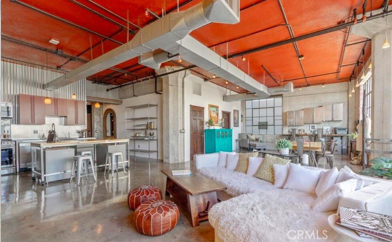 Step into one of Downtown LA’s best-kept secrets — a corner live/work loft in the iconic Textile Building, located in the Fashion District that effortlessly blends historic charm with modern style. As soon as you walk in, you’ll notice this isn’t your average loft. The current owners have truly made it special, with thoughtful upgrades that bring a cheerful, designer touch to every corner.
With soaring ceilings, polished concrete floors, and a wall of oversized original windows, the space feels bright, open, and alive with energy. Whether you're an artist, entrepreneur, or just someone who loves downtown living, this layout offers incredible flexibility. The gourmet kitchen is ready for your culinary adventures with stainless steel appliances and a generous open layout that makes entertaining a breeze.
The primary bedroom feels like a quiet retreat, tucked away from the main living space for added privacy — and yes, there’s a spacious walk-in closet too. Both bathrooms are beautifully finished, adding to the home’s elevated feel.
But what really sets this home apart is the community around it. As part of Santee Village, you’ll have access to rooftop decks with panoramic city views, a pool, spa, gym, BBQ area, basketball court, and even a driving range. There’s always something going on, and always a friendly neighbor to meet.
The building is Mills Act approved, which means you’ll benefit from significantly reduced property taxes — a rare perk in LA. You also get your own dedicated parking space and private storage unit. And yes — an incredibly pet-friendly atmosphere make this place even more of a gem.
If you’ve been waiting for a downtown loft that has both character and community, this is the one. Come experience what it’s like to live in a space that inspires you every day.