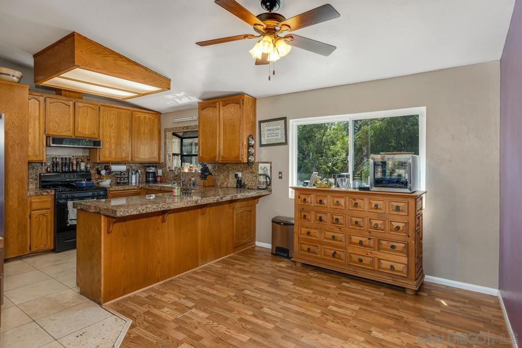 VRM: Seller will entertain offers between $779,000 & $849,777. OWNED SOLAR & RV PARKING!!! Come see this 3 bedroom, 2 bath home on over a 1/3 of an acre lot. Enter the home into the HUGE family room with 2 steps up to the kitchen, dinning room & bedrooms. Home boasts granite counters, lots of beautiful wood cabinets with direct access to the family room & opens up to the breakfast area. Massive dinning room with a bay window leads to the bedrooms. Huge primary suite with lots of closet space a slider to the balcony. 2nd bedroom is also huge with massive closet space and a slider out to the balcony. 3rd bedroom has a bay window and is across the hall from the bathroom. Outside at the bottom the balcony stairs are 2 extra rooms which are not included in the square footage and have great potential!!!