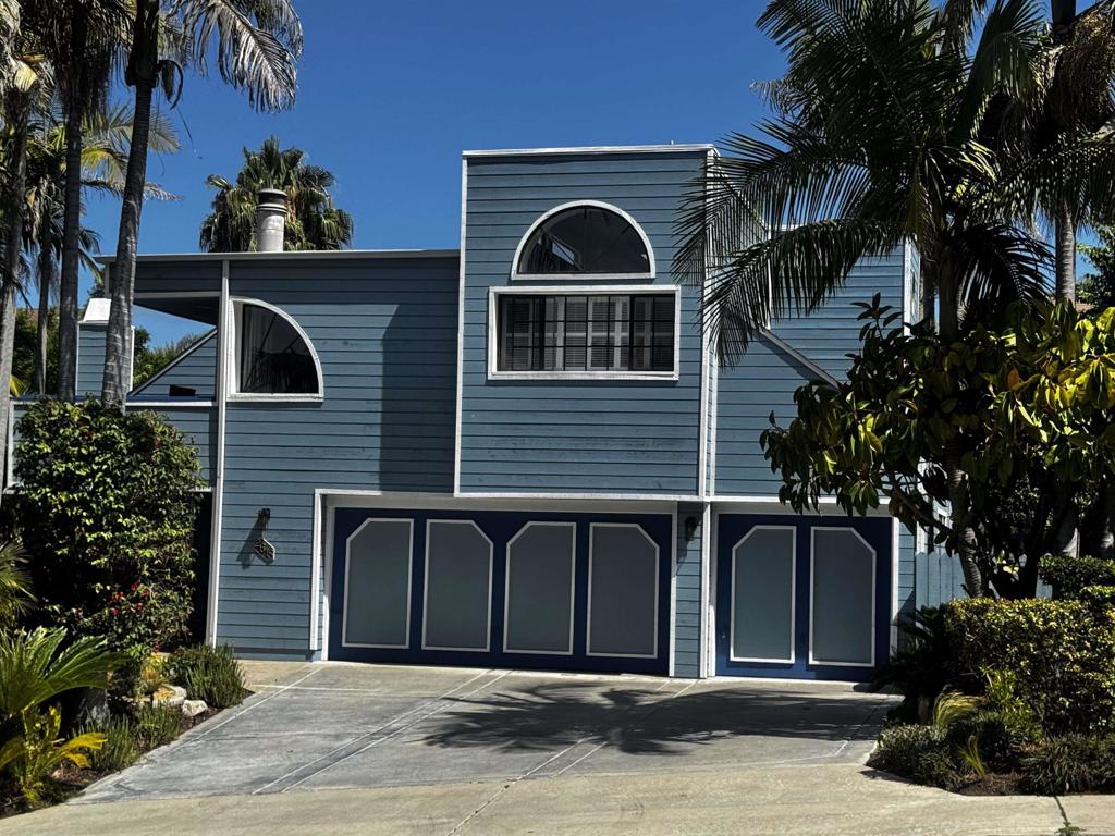 (more pictures coming soon) Ocean View Retreat with Artistic Flair & Lush Garden Oasis Step into this beautifully customized 2-story home that masterfully blends comfort with architectural charm. Move-in ready and impeccably maintained, this 4-bedroom, 3-bath sanctuary offers: Spacious layout with one bedroom and full bath conveniently located downstairs Architectural elegance with high, angled ceilings, abundant natural light from 8 strategically placed skylights, and uniquely crafted windows bringing in sunshine from all directions. Updated kitchen offers a wine cabinet and a center island. Expansive 4-car garage giving plenty of space for vehicles, hobbies, or storage Situated on 1/3 acre, the primary bedroom features a private balcony with ocean views and sunsets. Landscaped garden with an artistic flair: whimsical paved pathways wind through a vibrant display of foliage, flowering plants, and pots in varied sizes, shapes, and tones of blue. Backyard sanctuary includes a charming pergola with string lights, cozy furniture, and peaceful privacy. Serene goldfish pond, thoughtfully stocked with mosquito fish to keep things tranquil and pest-free. Every corner of this home feels intentionally designed—with playful angles, natural light, and calming outdoor escapes that invite you to settle in and truly savor each day.