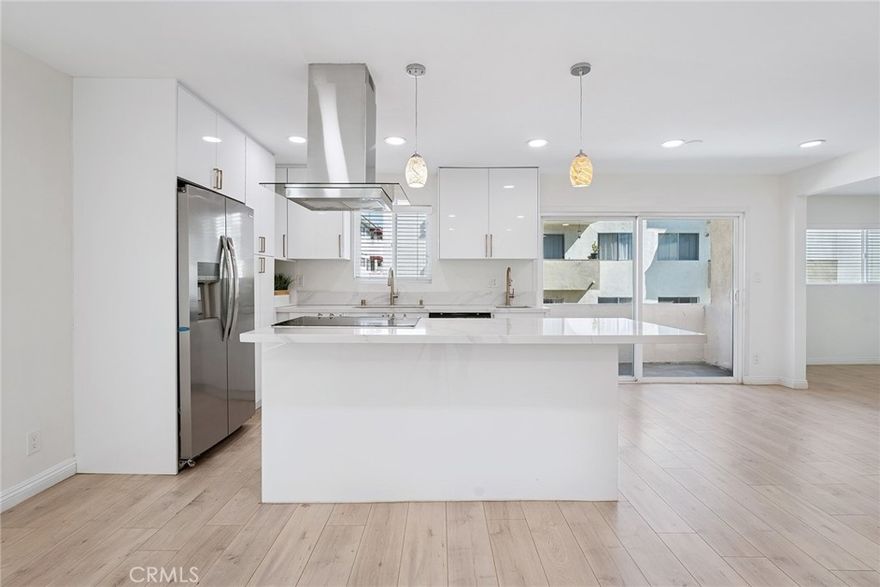 Beautifully Upgraded 2+2 End Unit Condo with Bonus Room in Prime Encino Location! Welcome to this light-filled and stylishly remodeled end-unit condo located in the desirable Encino Terrace community. This spacious 2-bedroom, 2-bathroom home also includes a versatile bonus room—perfect for a home office, den, or easily convertible into a third bedroom, complete with a wall-to-wall custom built-in closet. The open-concept layout features a chef-inspired kitchen with a large island, quartz countertops, stylish cabinetry, double sinks, stainless steel appliances, and a sleek range hood. The kitchen flows seamlessly into the dining and living areas, creating a perfect space for entertaining. Natural light floods the unit, highlighting the brand-new flooring and recessed lighting throughout. The primary suite is spacious and bright, with a beautifully upgraded en-suite bathroom offering double sinks, a walk-in shower, and a custom walk-in closet. The secondary bedroom includes a built-in desk and its own custom closet, with a full bathroom conveniently located nearby. Additional highlights include dual-pane windows, updated finishes throughout, and two covered tandem parking spots with storage, located close to the unit. Enjoy the resort-style amenities of Encino Terrace, including two pools, a spa, gated entry, and two community laundry rooms—one just steps away from your door. Ideally located just off Ventura Blvd, you’re minutes from top restaurants, shopping, and easy freeway access. This turnkey unit combines comfort, function, and location—don’t miss this incredible opportunity to own in the heart of Encino!