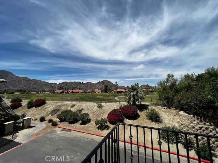 Looking for a stylish desert retreat that doubles as a wise investment? Welcome to Casitas Las Rosas—a charming, centrally located community in the heart of La Quinta.
This turnkey 1-bedroom, 1-bath upstairs condo is thoughtfully designed for comfort and convenience. The spacious master features a Cal king bed and a walk-in closet. At the same time, the living room offers a queen sleeper sofa for extra guests. Inside, you’ll love the fresh upgrades—new vinyl wood flooring, updated furniture, stainless-steel appliances, and granite countertops. A cozy gas fireplace adds warmth on cool desert nights, while your private balcony invites you to unwind with morning coffee or take in the sunset views of the Santa Rosa Mountains.
Set in a prime location at the rear of the community, the condo overlooks the adjacent SilverRock golf course, providing a sense of peace and privacy. Step outside and you’re just a short stroll from Old Town La Quinta with its boutiques, galleries, restaurants, and seasonal events. Festival grounds, hiking trails, PGA West, Indian Wells Tennis Garden, and Civic Center Park are all close by.
When it’s time to relax, enjoy access to four community pools and hot tubs, all surrounded by palm trees and mountain views. With ample parking, low-maintenance living, and Short-Term Vacation Rental approval, this property is equally suited as your personal getaway or an income-producing rental.
Don’t miss this opportunity to own a little slice of La Quinta paradise—fully furnished and move-in ready.