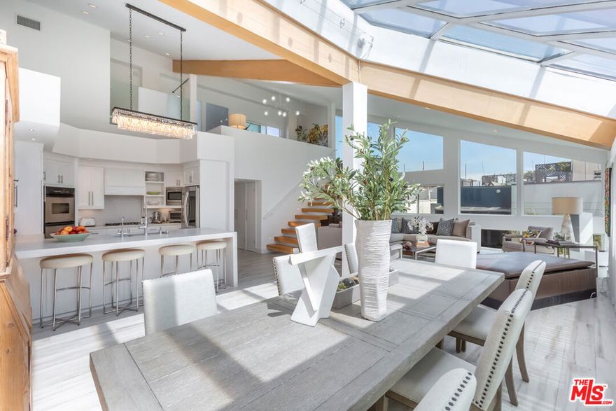 This one-of-a-kind, ultra-chic penthouse is the epitome of California beach living just 50 feet from the sand! With one of the lowest HOAs in the area and NO rental restrictions, this is an unbeatable opportunity for investors or jet-setters looking to offset ownership costs with short-term rental income. Reimagined from top to bottom with designer upgrades, this sun-drenched showstopper features soaring ceilings, walls of light, and a layout that's both effortlessly elegant and totally livable. Two spacious bedrooms, a versatile loft (ideal as a third bedroom, media lounge, or home office), and spa-inspired bathrooms maximize comfort and functionality. The chef's kitchen is a dream, the in-unit laundry is a must, and two private rooftop patios are your personal escape perfect for morning coffee or evening cocktails with ocean views. Additional perks include two garage parking spaces, storage, guest parking, and a location that's just moments from the Marina, LAX, the 405, and some of LA's best dining, shopping, parks, and the iconic beach bike path.Bonus: A public parking lot is just three blocks away if street parking is full. This is your chance to live or invest in the California dream. Sunset views included. Property is also for lease at $10,500.