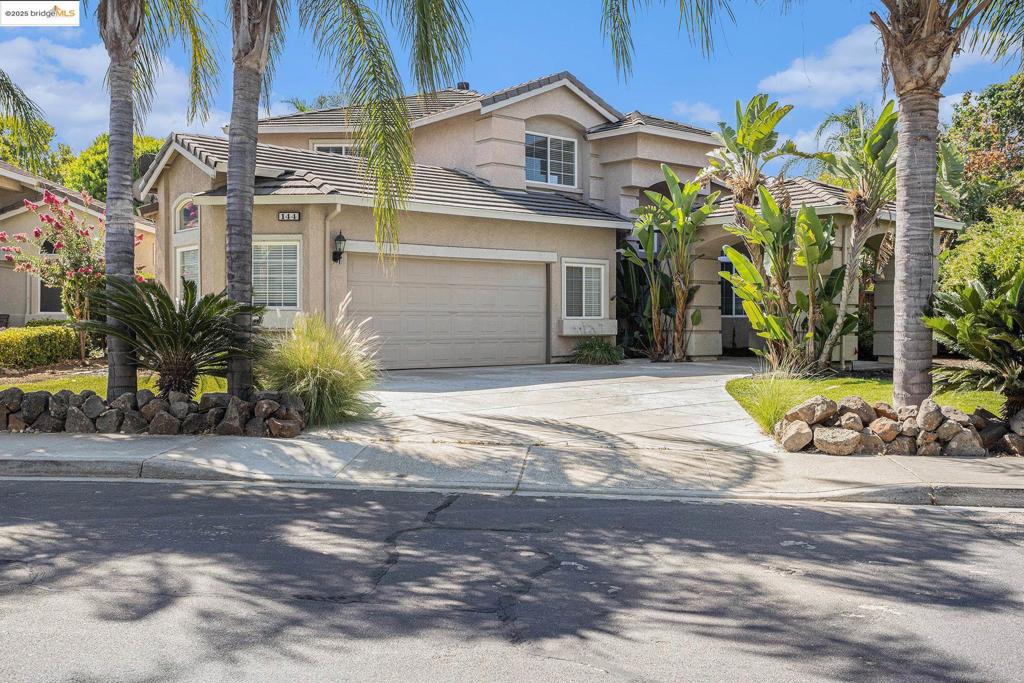 This beautifully remodeled Shadow Lakes home blends modern organic design w/warm, livable comfort—& sits on a lushly landscaped lot that feels like a private escape. Inside, wide-plank white oak LVP flows through every room, complemented by fresh, soft-white paint that keeps the spaces airy & bright. The kitchen is a showstopper w/shaker-style cabinetry in a matching hue (different sheen for subtle dimension), brushed knurled-gold hardware, sleek quartz countertops, & updated stainless-steel appliances. Bathrooms in the hallway & kitchen share the same aesthetic. The flexible layout offers a bright living room, a main-level bedroom, & a full bath w/walk-in shower at the entry. A few steps down, you’ll find the dining area, kitchen, & family room—plus 2 sliding glass doors inviting you to the backyard. Upstairs, the primary suite enjoys its own private level, while the top floor offers 2 add'l bedrooms, full bath, & laundry room. Outside, you’ll discover a generous backyard wrapped in tropical landscaping, perfect for unwinding by the in-ground pool or entertaining on warm evenings. The two-car garage boasts the storage capacity of a 3-car space--room for all your gear. W/fresh finishes, thoughtful updates, & a backyard oasis, this Shadow Lakes home is ready to welcome you!