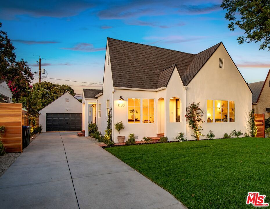 Luxurious Magnolia Park Tudor cottage. Completely remodeled spacious 2,005 sq. ft. 4+3 (2 main en suites incl. balcony, walk-in closet, wet room w/spa shower and oval tub). Built in 1930 when Magnolia Park was blossoming w/new storybook homes convenient to major studios. Charming Dutch-door entry to open plan enhanced by flowing hardwood floors, vaulted ceilings and skylights. Windows (and doors) are all new. Original plaster details, new smooth stucco and new roof. Bright inviting fireside living room flows to new designer kitchen featuring quartz countertops, large island, stainless steel appliances, farmhouse sink, open shelves, dining area and huge family room w/fabulous arched alcove of built-ins and sliders to patio. Stackable laundry and central HVAC. Private outdoor oasis w/patio, deck and new landscaping. Detached garage and additional approx 100sqft finished shed or playroom + room for pool on flat, fenced 6,750 sq. ft. lot. Short stroll to amazing coffee, restaurants and shopping. Top rated schools.