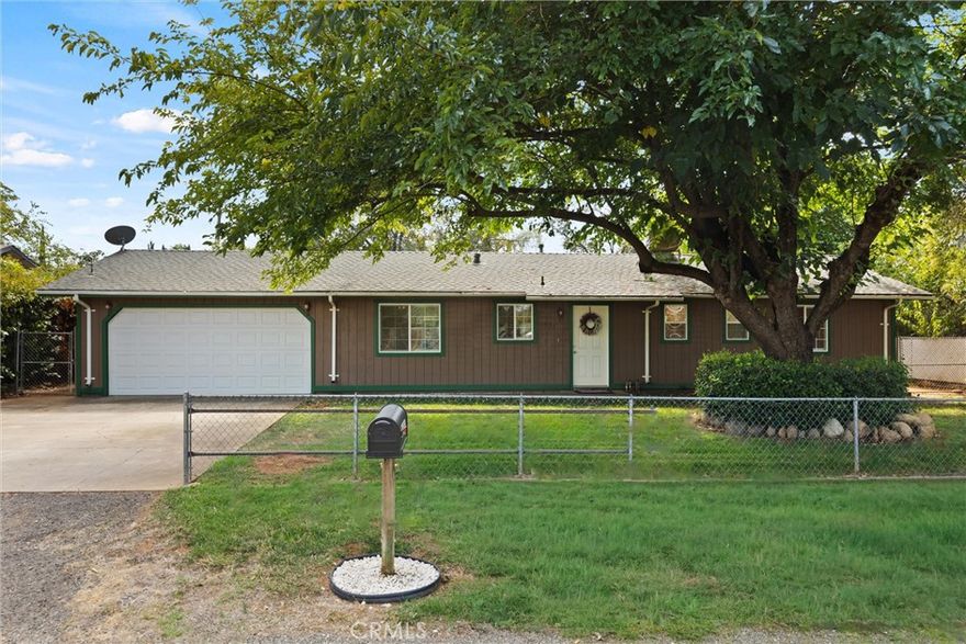 This beautifully updated 3-bedroom, 2-bathroom home is situated on a spacious 0.22-acre lot in a quiet cul-de-sac. As you enter, you're greeted by a well-appointed kitchen featuring sleek granite countertops and plenty of storage space—perfect for everyday meals or entertaining. Just beyond the kitchen, you have a cozy dining area that opens up to a welcoming living room. The primary suite is generously sized and includes its own private en-suite bathroom for added comfort. Two additional bedrooms provide flexibility—whether used as children’s rooms, guest accommodations, or a home office. Outdoors, enjoy a private and fully fenced backyard oasis with lush landscaping and ample space for gardening, play, or relaxation. Whether you’re hosting a gathering or enjoying a quiet evening under the stars, the front and backyards are designed for both recreation and tranquility. Completing the property is an attached two-car garage, offering secure parking as well as additional storage for tools, hobbies, or equipment. This move-in ready home combines comfort, convenience, privacy, and space, making it the perfect place to call home for anyone seeking a peaceful retreat.