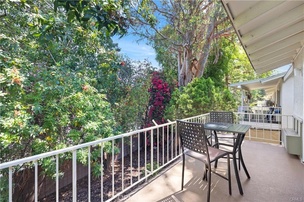 Experience tranquil living in this beautifully updated 2-bedroom, 2-bathroom "CASA BLANCA" model nestled within the lush surroundings of Laguna Woods community of 55 Yrs. plus. This inviting upper-level residence offers stylish living spaces enhanced by natural light, Cathedral ceilings, a Refrigerator Washer/Dryer, and Freshly painted and serene treetop views from your private balcony. Upon entering, you will discover a bright, open living area featuring tile flooring, smooth ceilings, and crown molding, seamlessly extending to the spacious outdoor balcony ideal for relaxing and enjoying. Adjacent is the cozy dining area flowing into the remodeled kitchen, which boasts warm-toned cabinetry, granite countertops, modern appliances, and ample storage space. The bedrooms are generously sized with brand new hard floors. The primary suite has two windows as it is an end unit. Both bathrooms feature granite vanities, updated fixtures, and nice touches, and the parking space is very convenient across the building. In addition, it is conveniently located right inside Gate 2... Medical Facilities, Shopping, Restaurants & More! Don’t miss taking a look at this one before it's gone! Add all this to the amenities offered by Laguna Woods Village... you have a winning combination -- 27 hole championship golf course or the 9-hole executive par three courses, tennis, paddle tennis, pickleball, lawn bowling, two fitness centers, seven clubhouses, five swimming pools, an equestrian center, gardening opportunities, an art studio, world-class woodshop, over 200 clubs and organizations ensure you will never get bored here! Plus, free bus transportation around the community, nearby shopping, and bus trips. Also, there is a very economical RV storage area where you can park your RV. Country Club Living is at its BEST and approximately 6 miles from Beautiful Laguna Beach!