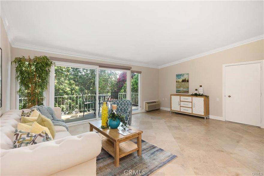 Experience tranquil living in this beautifully updated 2-bedroom, 2-bathroom "CASA BLANCA" model nestled within the lush surroundings of Laguna Woods community of 55 Yrs. plus. This inviting upper-level residence offers stylish living spaces enhanced by natural light, Cathedral ceilings, a Refrigerator Washer/Dryer, and Freshly painted and serene treetop views from your private balcony. Upon entering, you will discover a bright, open living area featuring tile flooring, smooth ceilings, and crown molding, seamlessly extending to the spacious outdoor balcony ideal for relaxing and enjoying. Adjacent is the cozy dining area flowing into the remodeled kitchen, which boasts warm-toned cabinetry, granite countertops, modern appliances, and ample storage space. The bedrooms are generously sized with brand new hard floors. The primary suite has two windows as it is an end unit. Both bathrooms feature granite vanities, updated fixtures, and nice touches, and the parking space is very convenient across the building. In addition, it is conveniently located right inside Gate 2... Medical Facilities, Shopping, Restaurants & More! Don’t miss taking a look at this one before it's gone! Add all this to the amenities offered by Laguna Woods Village... you have a winning combination -- 27 hole championship golf course or the 9-hole executive par three courses, tennis, paddle tennis, pickleball, lawn bowling, two fitness centers, seven clubhouses, five swimming pools, an equestrian center, gardening opportunities, an art studio, world-class woodshop, over 200 clubs and organizations ensure you will never get bored here! Plus, free bus transportation around the community, nearby shopping, and bus trips. Also, there is a very economical RV storage area where you can park your RV. Country Club Living is at its BEST and approximately 6 miles from Beautiful Laguna Beach!