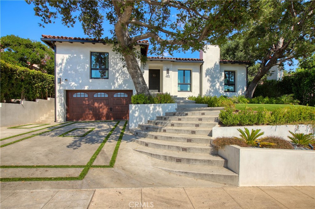 Welcome to 452 Woodbury Rd., a newly remodeled Spanish charmer nestled atop the hills of the Woodbury enclave in Glendale. This masterfully reimagined home has been tastefully updated with modern touches throughout giving it a luxurious yet calming, Zen-like retreat feel. The home has almost every modern amenity imaginable featuring 2,398 SF of living space, 4 bedrooms including a royal primary suite, 4 bathrooms, chevron hardwood flooring, custom walk-in closets, high-end stainless appliances, an open floor plan with abundant natural light and vaulted ceilings. The lush and private backyard greets you with a covered patio, glistening pool & spa, manicured landscaping and a custom covered BBQ area making it THE perfect space for entertainment or family enjoyment. Do not miss the opportunity to enjoy Glendale living at its finest with easy access to the 134 and 2 Freeways minutes away from DTLA, Glendale Adventist and Glendale Community College.
