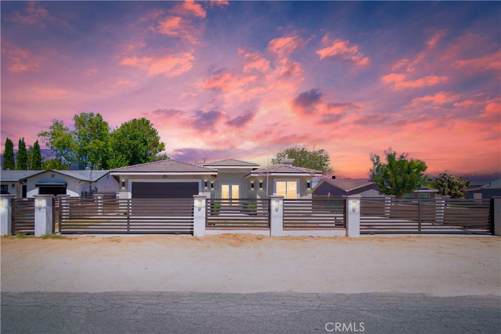 Welcome to this stunning modern residence built in 2018, offering the perfect balance of sophistication and comfort. Nestled on a sprawling 20,908 sq. ft. lot in a quiet neighborhood, this 4-bedroom, 3-bathroom home spans 2,312 sq. ft. of living space, thoughtfully designed for both elegance and functionality.
Step inside and experience soaring high ceilings that create an airy, open feel throughout. The chef-inspired kitchen is a true centerpiece, equipped with premium finishes and accessories designed for culinary excellence. Retreat to the luxurious primary suite, featuring a spa-like bathroom with rainfall shower, built-in sauna, and soaking tub the ultimate space to relax and unwind.
This home is as practical as it is beautiful, boasting paid-off solar panels for energy efficiency and long-term savings. Outside, the expansive lot provides endless possibilities from entertaining to creating your dream outdoor oasis.
With the option of an assumable loan, this property presents a rare opportunity for today’s buyers to secure a piece of modern luxury living with added financial ease.