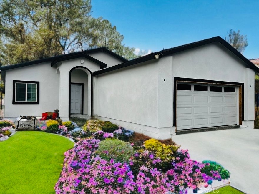 NO HOA DUES, PAID SOLAR PANELS. This modern captivating single-story home is at the final stages of its construction. It presents a desirable living area of 2,212 sq. ft of open concept living area. A specious stylish kitchen with white cabinetry and quartz countertops overlooks the enticing family room and dining room. Soaring 9' ceilings create a sense of grandness in every room. This dream home features stain free waterproof laminate flooring throughout.  The inviting primary suite offers two individual walking closets and the grand master bathroom with sleek dual vanity. You will be amazed with the floor lay out of the additional 3 bedrooms and 2 full bathrooms.  Landscaped front yard with sprinkler system, driveway, walkway, and sidewalks to be laid prior to closing.  (picture here has been digitally enhanced). Let's not omit the pool-size block-fenced back yard waiting for your personal touch to make it the background of all those family memorable moments.  This bargain priced home is located in an established tranquil neighborhood with breathtaking view of the mountains, withing walking distance to a peaceful local park, and less than a mile north of the 10 freeway. Do not miss this lovely home available for showing 11/01/2025.
