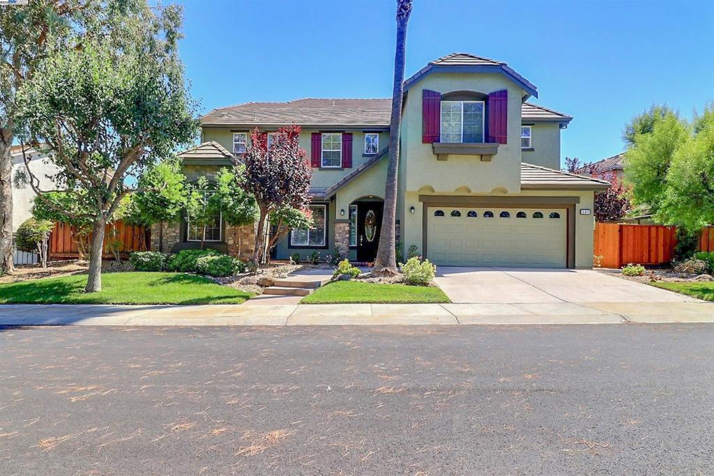 Welcome to this stunning former model home in the desirable Lakeshore gated community of Discovery Bay. Situated on a generous lot, this home blends comfort, convenience, and thoughtful upgrades. Inside, you’ll find fresh paint and new carpet throughout, built-in cabinetry in the office, and a well-appointed kitchen with a pantry as well as a brand new HVAC system. The spacious primary suite offers a spa-like retreat with a soaking tub, separate shower, and dual vanities. A full bedroom and bath with shower on the main level make hosting guests easy. The laundry room with sink adds everyday convenience. Step outside to enjoy a backyard designed for relaxation and entertaining, featuring a custom shade structure and plenty of space for gatherings. The side yard also has a large wood shed for ample storage. The Lakeshore community offers resort-style amenities including a pool, basketball courts, fitness path with workout stations, manned security gate, and scenic walking trails around the lakes. This home’s prime location within the neighborhood puts you close to it all.