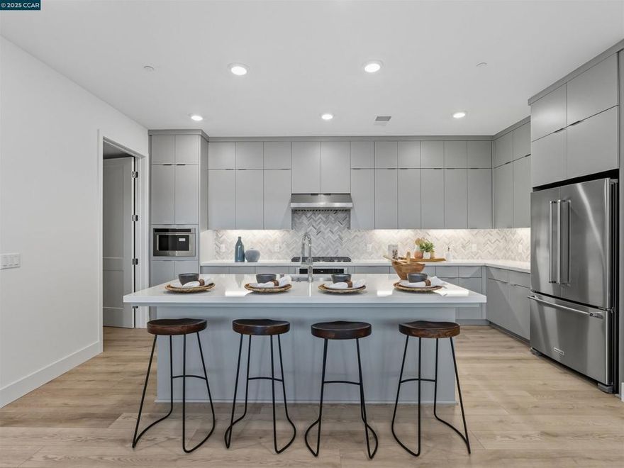 Victoria Station at Metro West brings new luxury condos and convenience to your doorstep with access to neighborhood retail, community park and clubhouse.  Open-concept floor plan, the bright great room and casual dining area are adjacent to a sizable office and desirable access to the outdoor covered balcony. The kitchen highlighted by a large center island, breakfast bar, plenty of counter and cabinet space, KitchenAid stainless steel appliances, as well as an ample walk-in pantry. Expansive primary bedroom suite is complemented by dual walk-in closets and a primary bath complete with a dual-sink vanity, a spa-like shower with seat, and a private water closet. Laundry room with Whirlpool front load washer and dryer.  This intimate 15 home condominium has a roof top deck with bar-b-que, fire pit, and seating area to enjoy with family and friends.  Exclusive to this community the comforts of a movie screening room, dog washing station, shared office work space, and entertainment kitchen area. Toll Brothers Newest Community in the sought after area of Fremont's Innovation District!! Great commute location with easy access to 680 and 880 as well as walking distance to BART.  Close to the 'High Tech' industry and schools. ( photos not of actual home, for marketing only) 3 left