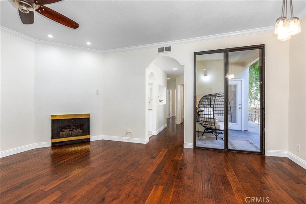 Stylish and move-in ready, this 2-bedroom condo in Bixby Knolls Terrace combines comfort, privacy, and a prime location near the Virginia Country Club. The home welcomes you with an EXPANSIVE WRAP AROUND PATIO shaded by mature trees, offering multiple access points for seamless indoor-outdoor living. Inside, the living room features rich hardwood-style floors, crown molding, recessed lighting, and a cozy gas fireplace.
The updated kitchen includes stainless steel appliances, a gas range, and a French-door refrigerator, complemented by crisp white cabinetry and a breakfast bar pass-through to the dining area. Both bedrooms enjoy direct patio access, with the spacious primary suite featuring a walk-in closet and private vanity area. The bathroom is refreshed with modern fixtures, while the dedicated laundry room offers a full-size washer and dryer. The BEST part is NO SHARED WALLS with your neighbors!
Additional highlights include central heating and air, ceiling fans, and freshly painted interiors that create a light and inviting atmosphere. The gated community provides a pool, spa, barbecue area, and secure subterranean parking with elevator access. One assigned parking space plus guest parking is included. The HOA is healthy, well-managed, and has already completed all required balcony repairs, giving buyers added peace of mind.
Located in the heart of Bixby Knolls, this home is within walking distance to shops, restaurants, and boutiques, with easy freeway access while still tucked away in a peaceful residential setting.
