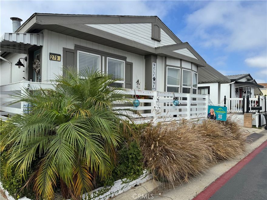 Welcome to this stunning "Coastal Chic Beach House" You will immediately notice the extra large porch in front with plenty of room for outdoor seating. Enter into the lovely Foyer (or third bedroom) and be impressed by the high ceilings, open floorplan and light and bright decor. Multiple skylights brighten up every room. Each room expertly and tastefully designed with White/Neutral tones reflecting the beach lifestyle. Also features a newer completely remodeled kitchen, bath and rooms from the high ceilings, to the beautiful tile and stone, to the wood-burning fireplace. Crown molding, Farmhouse Sink, Soft-close cabinets, upgraded lighting inside/out. Newer stainless steel appliances, upgraded vanities and toilets as well as Dual-paned windows, walk in closets, plenty of storage as well as a large outside storage shed. A new white vinyl fence was recently added for even more privacy and there is an enclosed area in the driveway for an outside seeating area/ dog area/ play area for the little ones. Community has a heated pool, full gym, jacuzzi, car wash area and guest parking in addition to your very own 2-3 car parking outside of home. Walk across the street to the beautiful "Surf City USA" Beach and watch all the sporting events, sailboats, concerts etc.. Walk or ride your bike and see how amazingly close you are to Pacific City, Main Street and all the ammenities Huntington Beach has to offer! Welcome Home... Beach Life...
