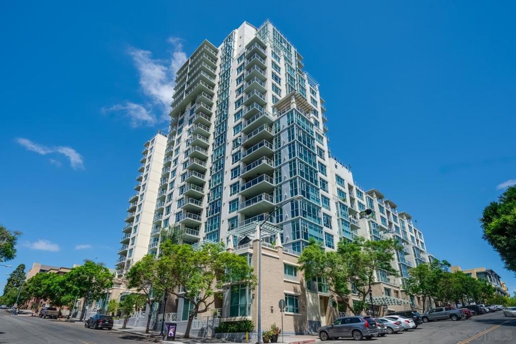 Welcome to The Discovery at Cortez Hill, your urban sanctuary in the heart of the city. Enjoy an array of upscale amenities including a rooftop pool and spa, fitness center, social lounge, and 24-hour concierge service. This spacious 2-story walk-up offers 1,610 square feet of living space, complete with a balcony and private patio. A rare find, the unit features two separate entrances, one with direct street access and the other from the building’s 2nd floor. Additional highlights include side-by-side parking, a deeded storage unit, and abundant closet space in both bedrooms and the versatile flex space. The main living area showcases floor-to-ceiling windows, a large balcony, and an ambient fireplace, creating an inviting atmosphere. The kitchen is outfitted with stainless steel appliances, granite countertops, under-cabinet lighting, and luxury vinyl plank flooring throughout. The split-level layout is ideal for guests or privacy. The lower level features the primary suite and a flex space perfect for a home office or den, with direct patio access to the street. Parking spaces are 189 and 241 located on P1. The storage unit is L147 located on P1.